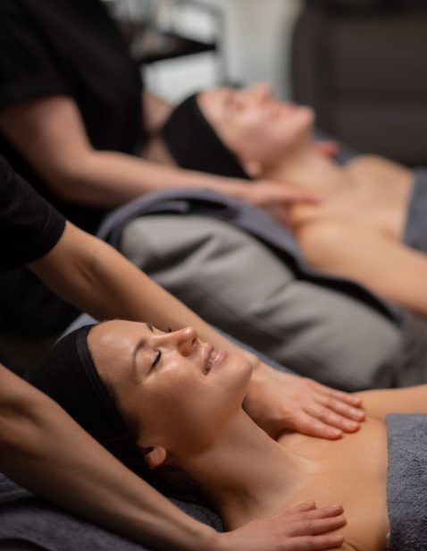 two middle-aged women enjoy beauty procedures two caucasian middle-aged women enjoy beauty procedures, face lift massage, they want smoothy skin without wrinkles, anti aging massage on neck and shoulders